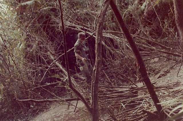 Preparing to blow up bridge in jungle